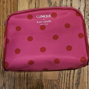 - Kate spade makeup bag made with Clinique. Pink and red. NWOT never used.